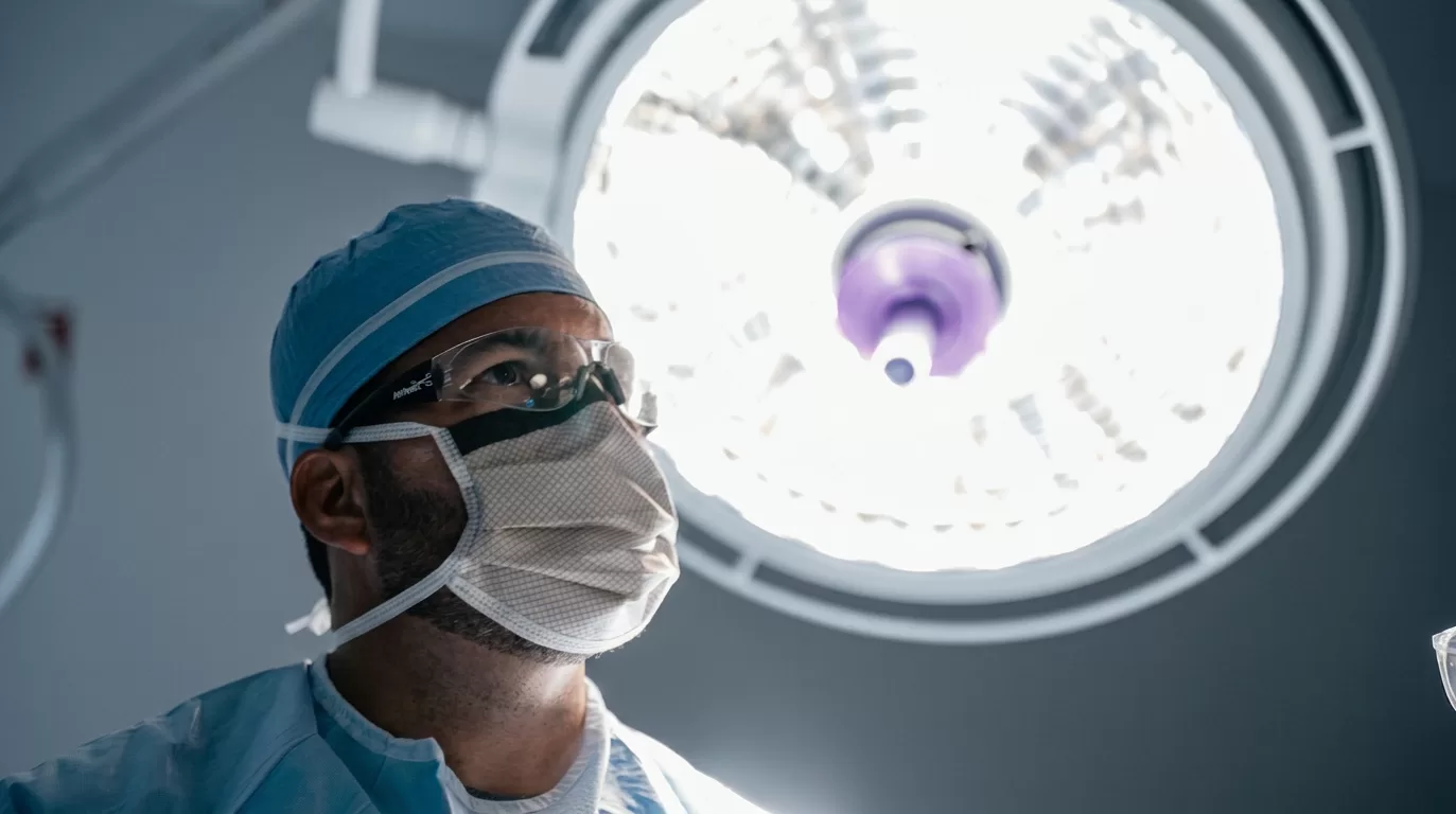 Dr. Jeremy Burnham In The Operating Room Under Surgical Lighting