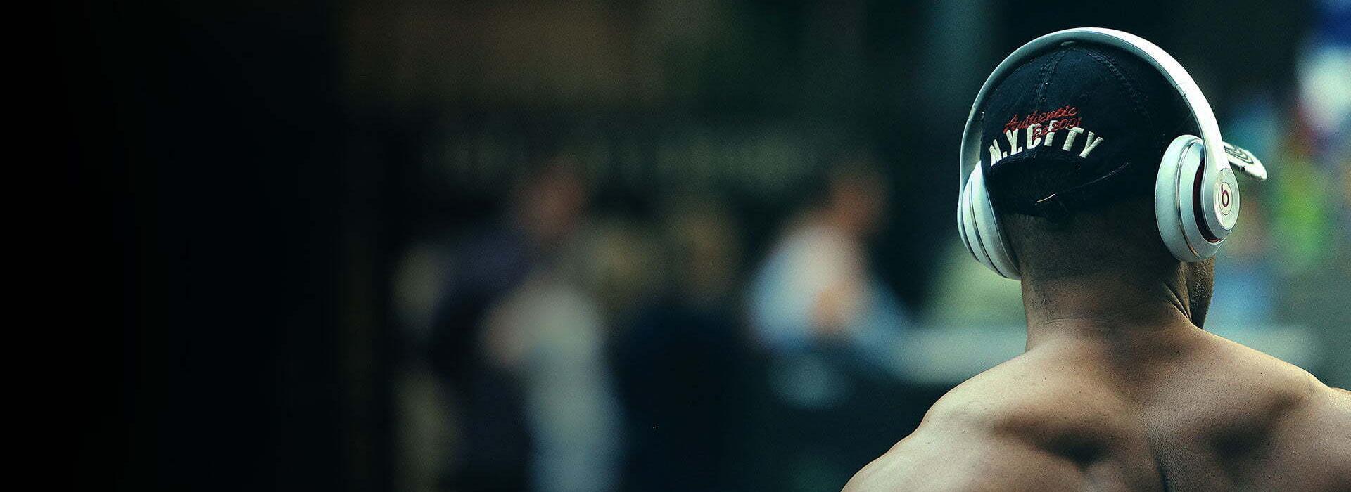 Athlete With Headphones - Elite Treatments Slider